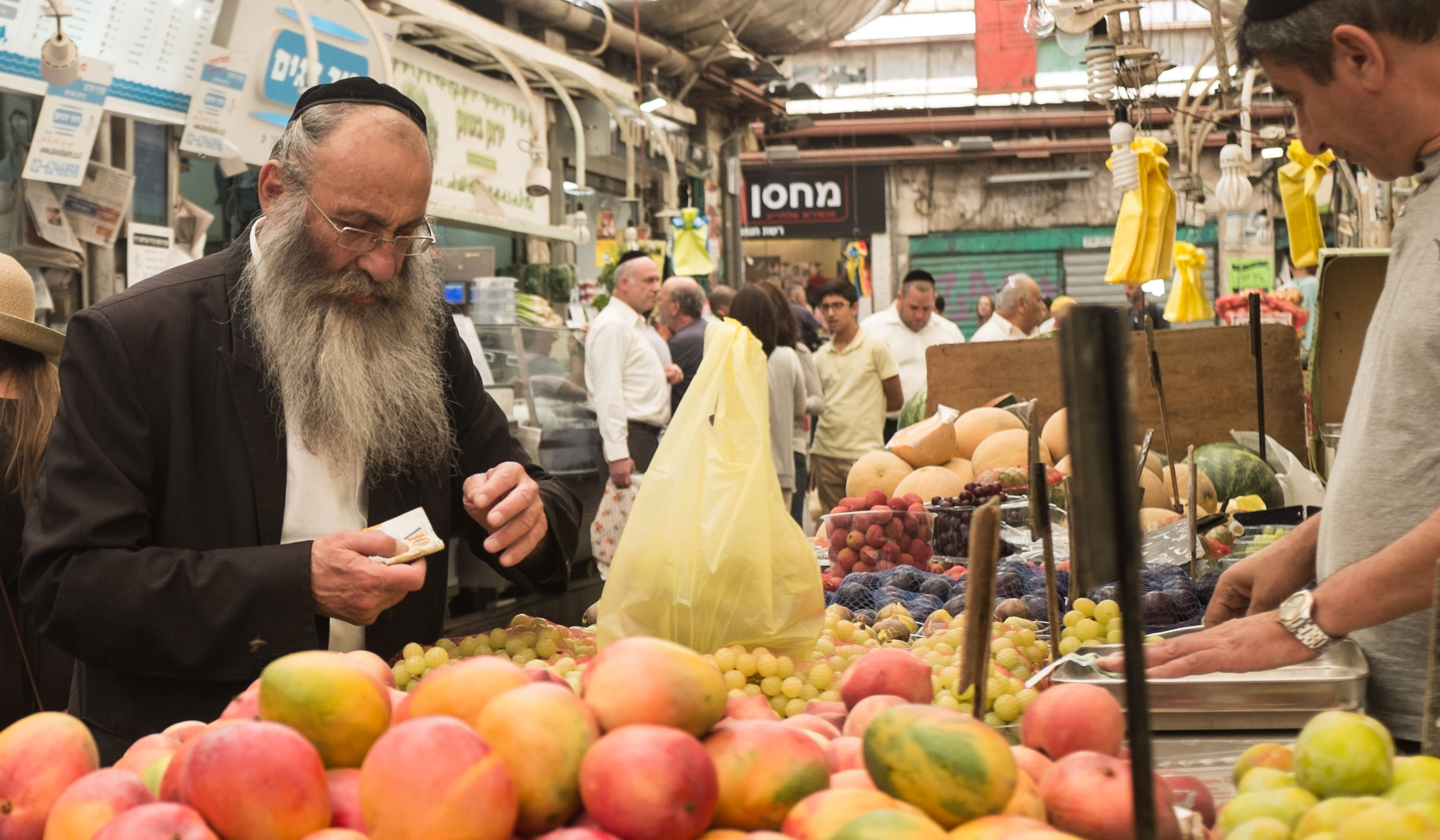 Jewish man buying produce