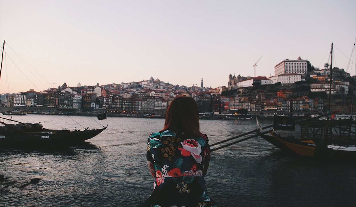 Woman sitting by a port