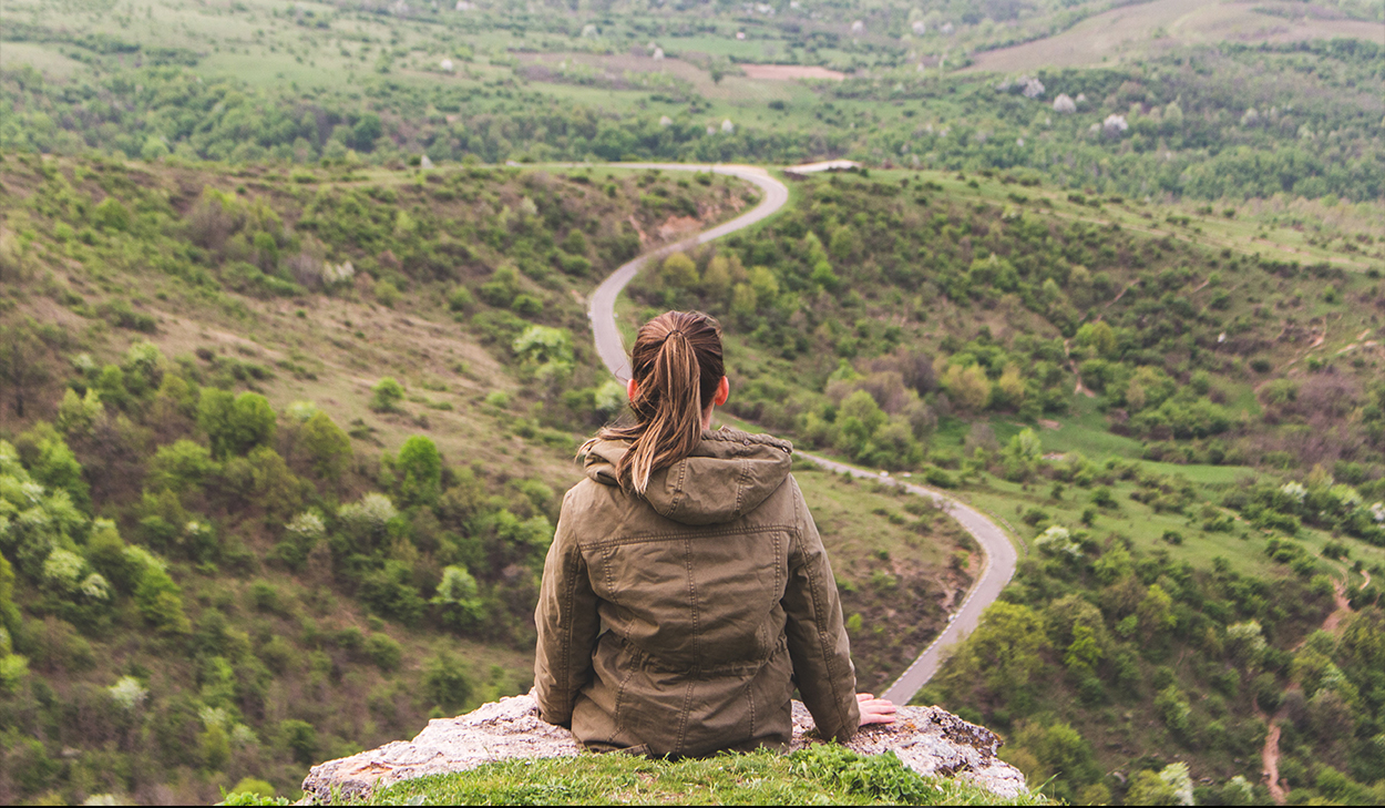 woman looking at a road