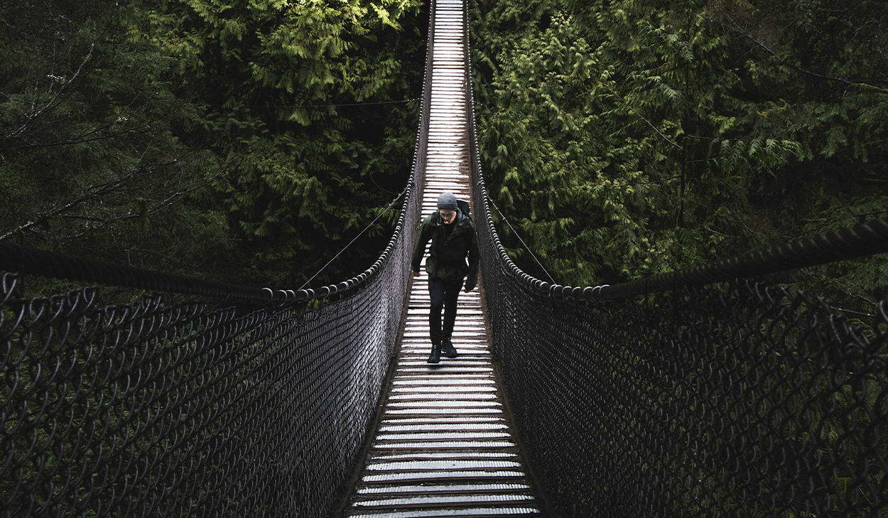 Man walking on a bridge