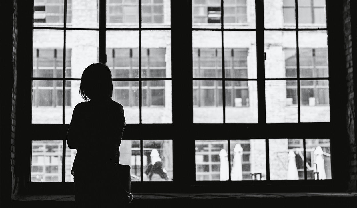 Woman looking out a window