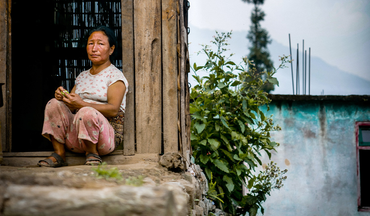 Woman sitting in a doorway