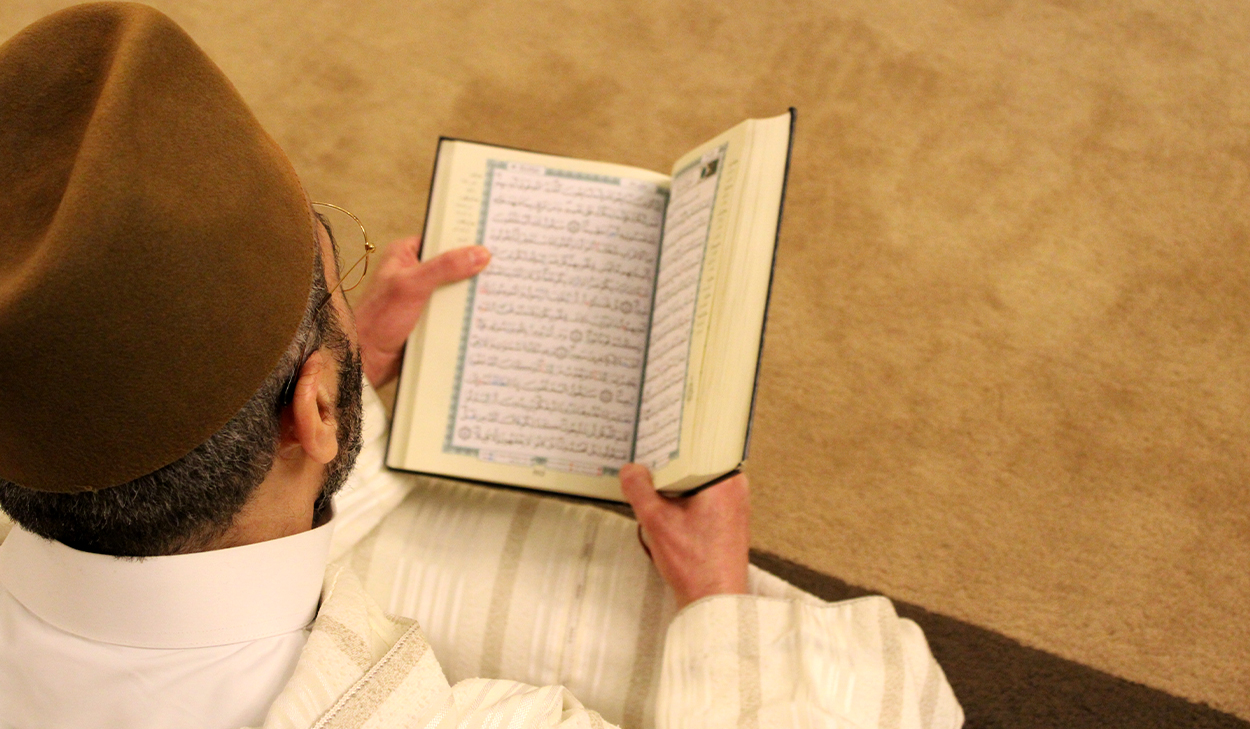 Man reading the Quran
