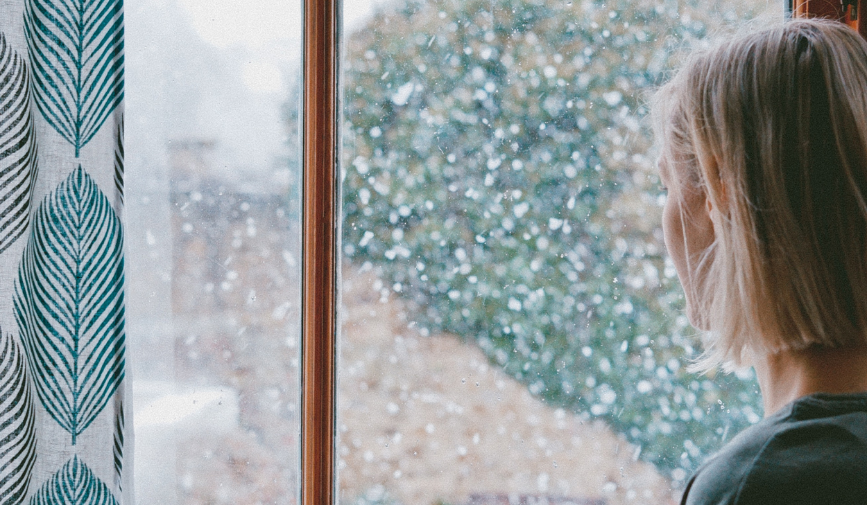 Woman looking out a window