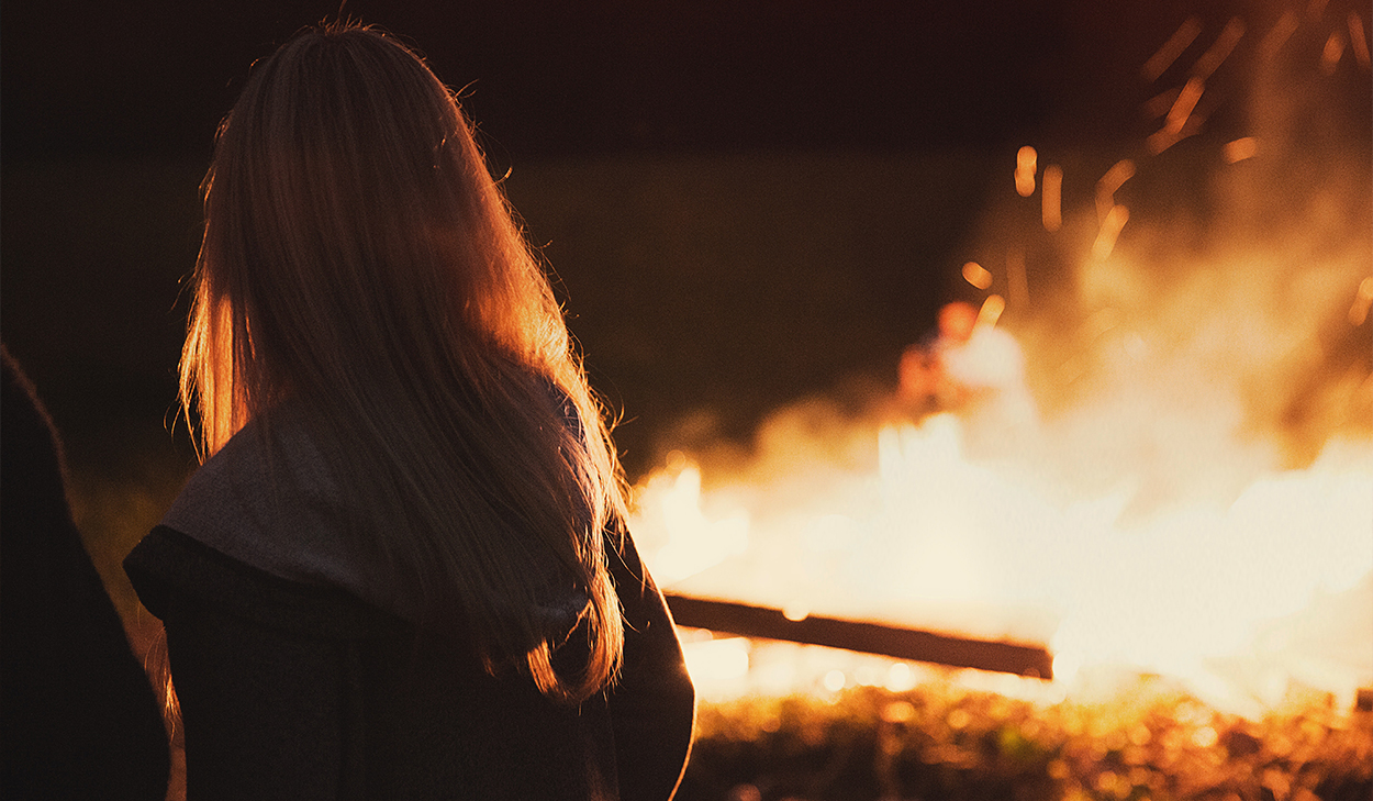 Woman near a fire