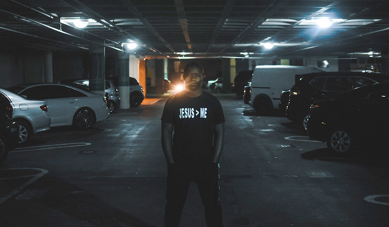 Man standing in a parking garage