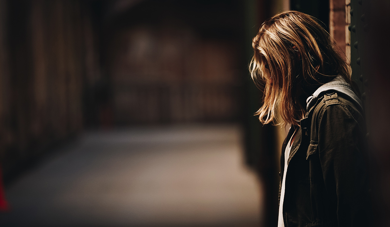 Woman with her head bowed