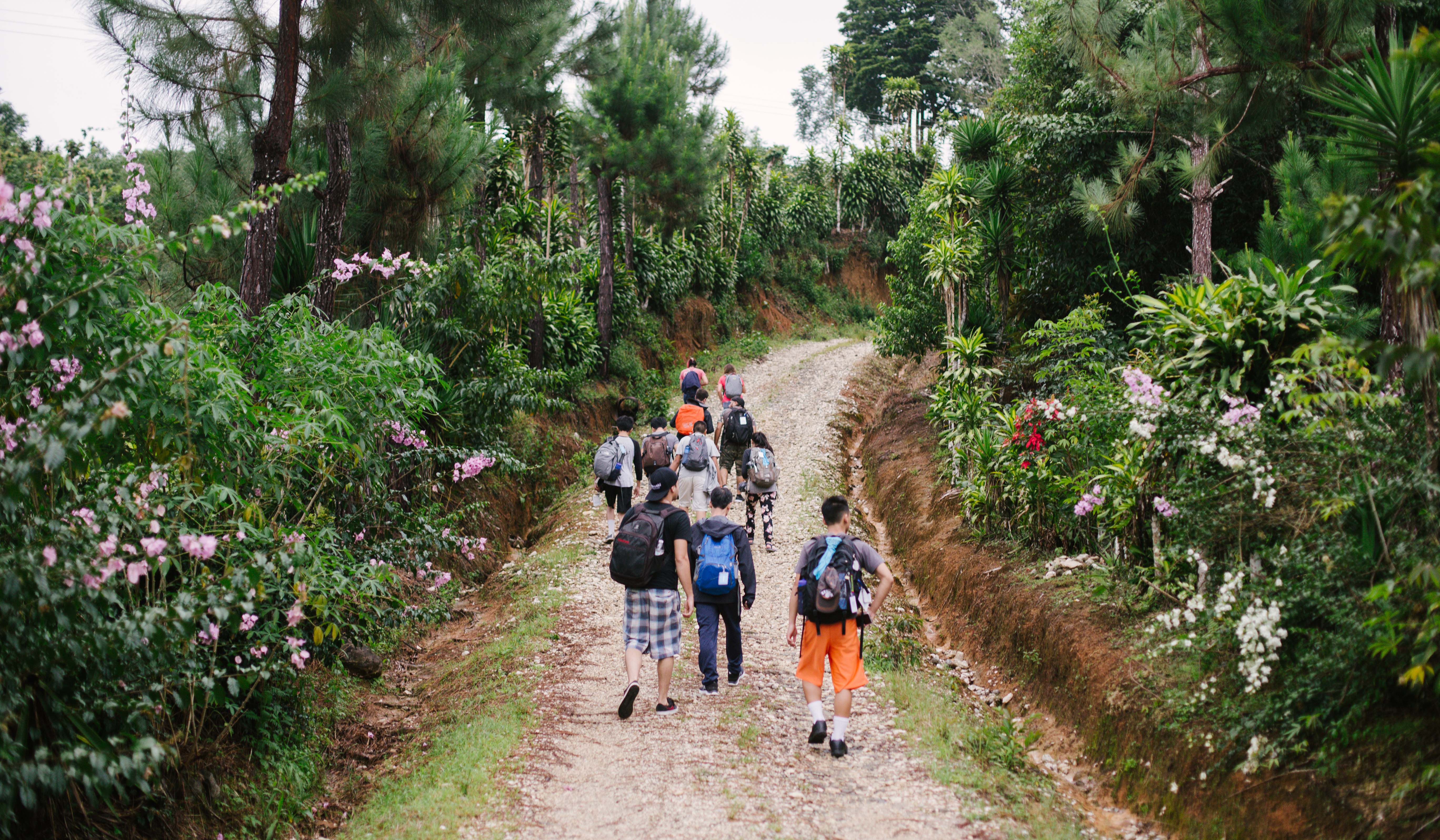 Group walking up dirt path