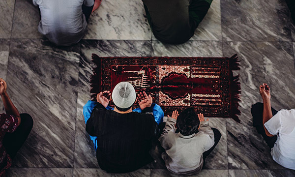 Muslim men praying