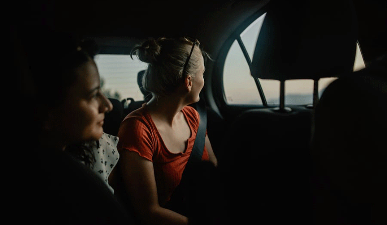 Women looking out a car window