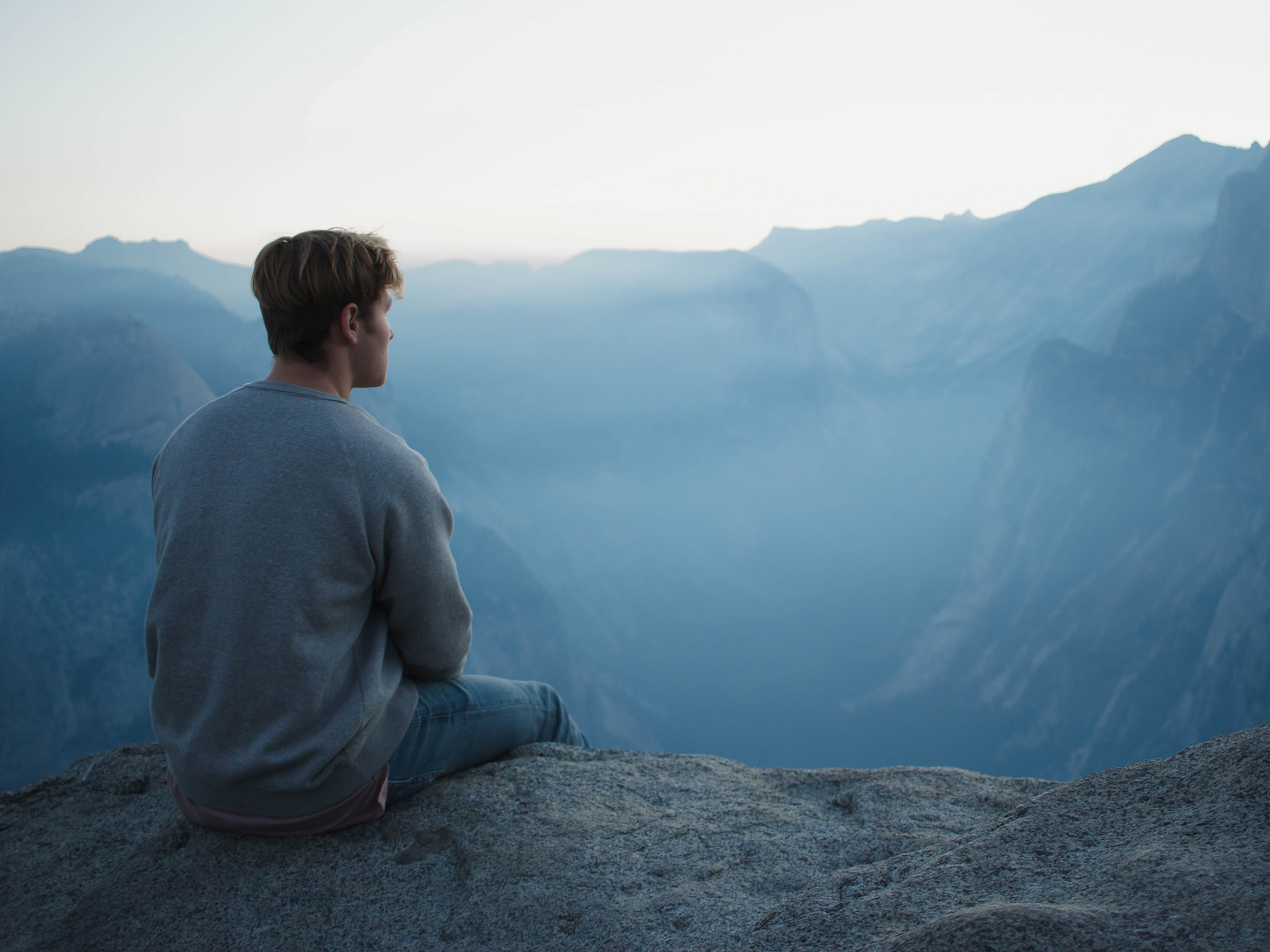 Man sitting on a mountainside