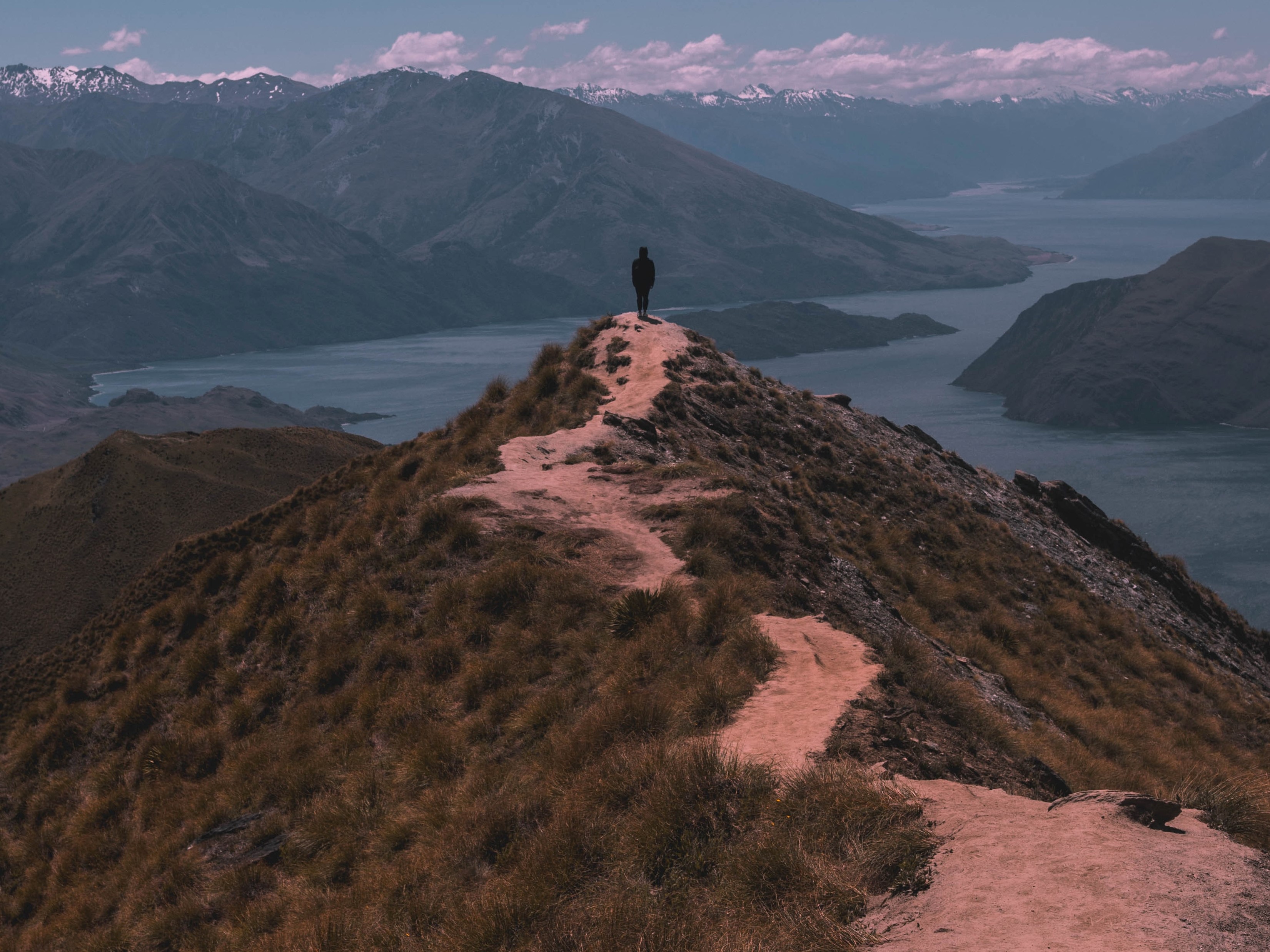 Person on a mountain ridge trail