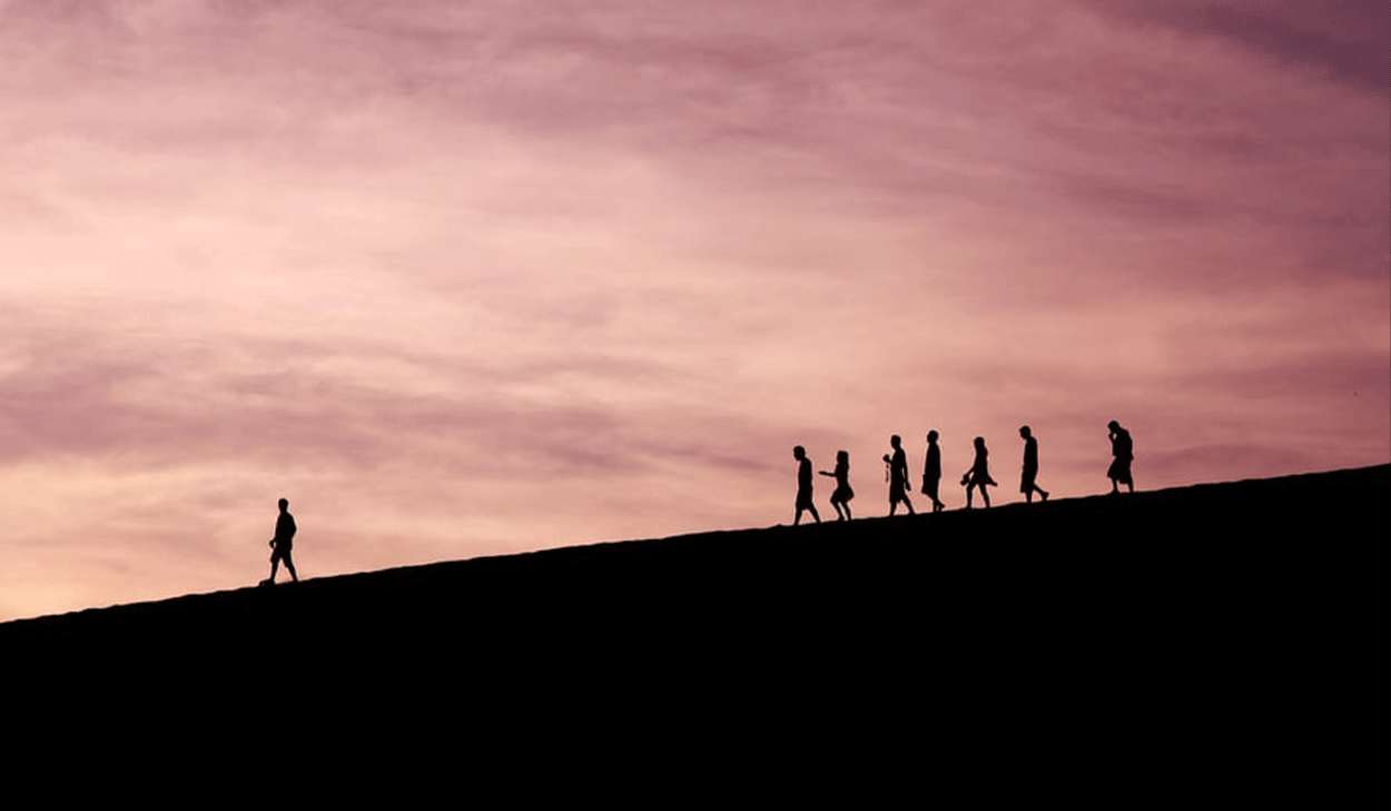 Silhouettes of people walking