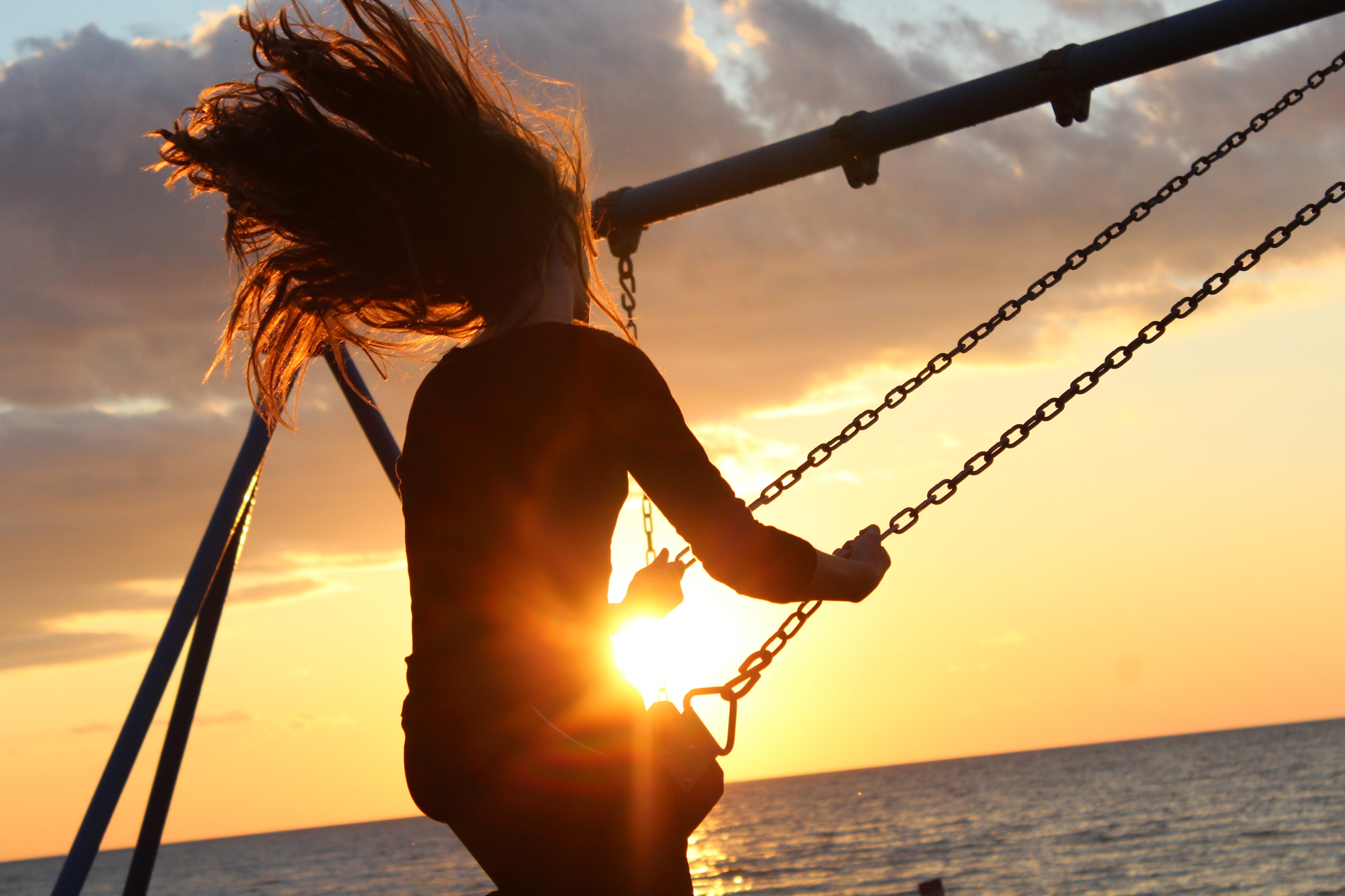 Person swinging in the sunshine