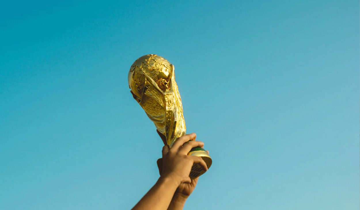 Hands holding a trophy to the sky